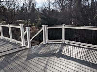 <b>Trex Transcend Island Mist Deck Boards with White Vinyl Lincoln Railing with Black Round Aluminum Balusters and matching cocktail rail in Ellicott City MD</b>